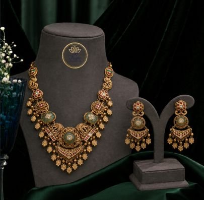 Antique Gold Temple Elephant Necklace Set with Pastel Green Stones & Ruby Accents | Divine Jewellery