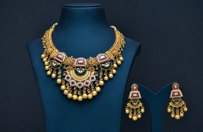 DIVINE Royal Kundan Temple Necklace Set with Antique Gold Finish, Ruby-Green Enamel Detailing & Matching Jhumka Earrings – Bridal & Festive Statement 