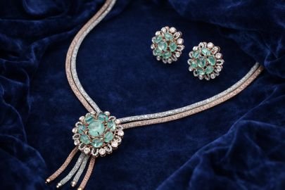 Elegant Dual-Tone Emerald Floral Necklace Set in 92.5 Silver with Gold & Rose Gold Plating